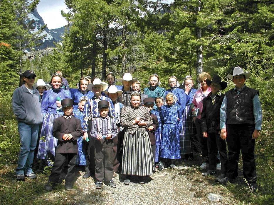a crowd of people in a forest in canada