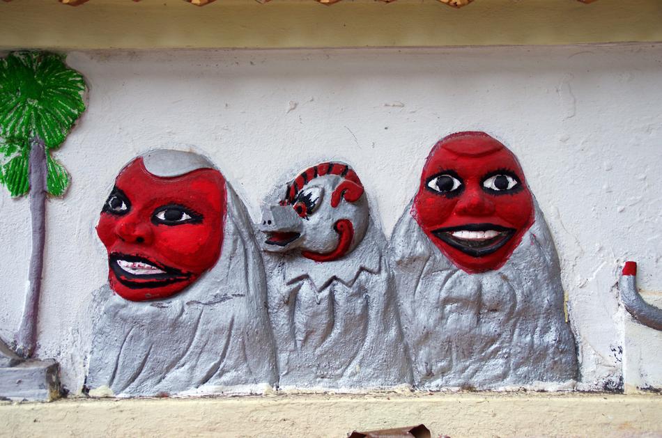 mural with red faces in vietnam