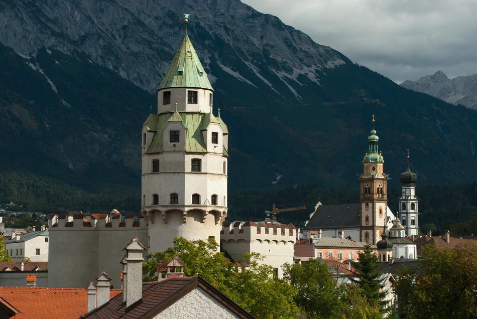 church in the background of mountains in austria