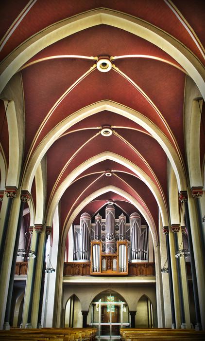 distant view of the church organ under the arches