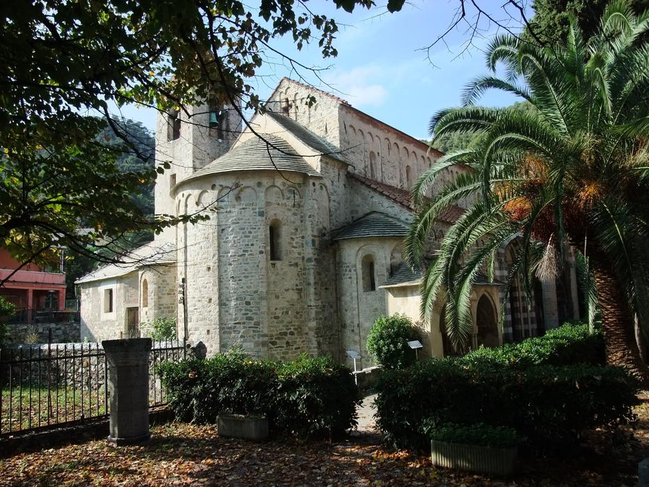 Beautiful San Paragorio church, among the colorful plants in Noli, Italy
