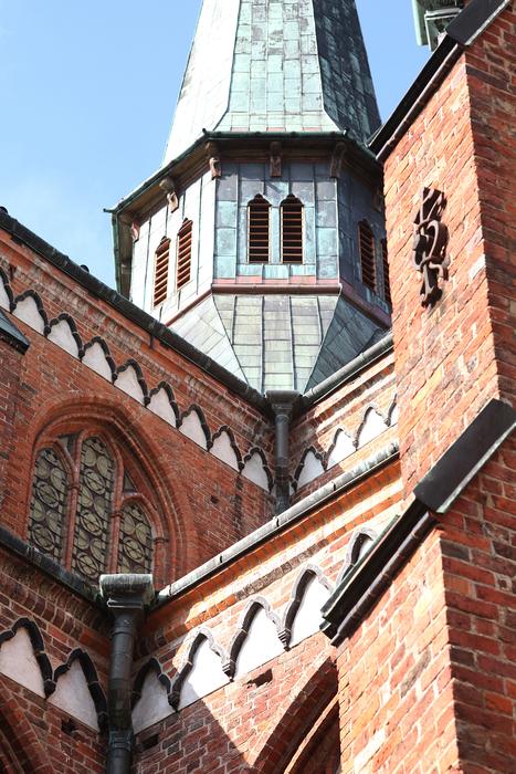 Beautiful and colorful tower and other buildings in sunlight, in MÃ¼nster, Germany