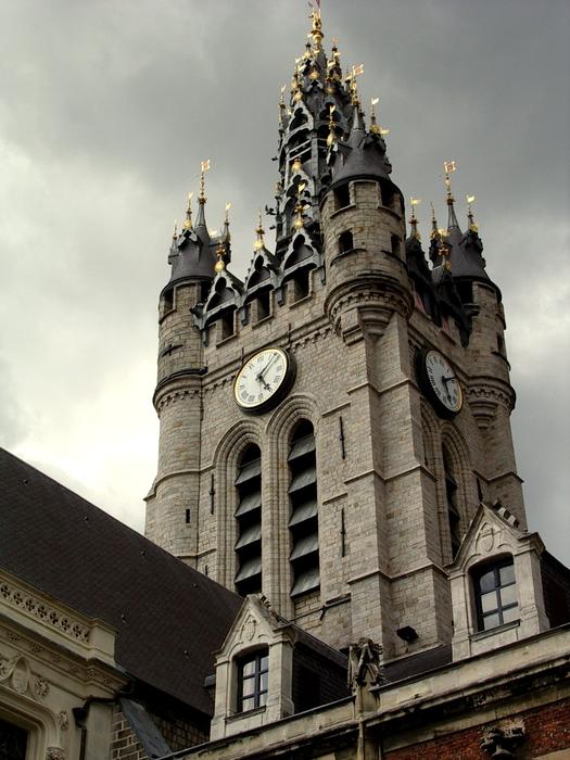 Beautiful Beffro with clock, in Douai, France, under the clouds