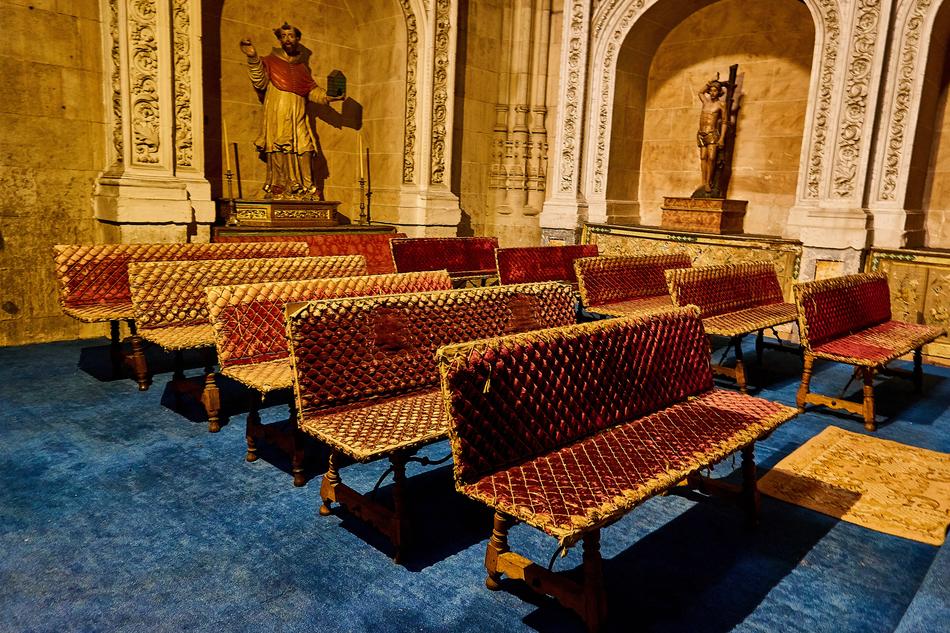 Beautiful interior of the cathedral in Salamanca, Spain, with statues and benches