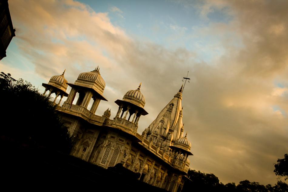 photo of the temple under the clouds