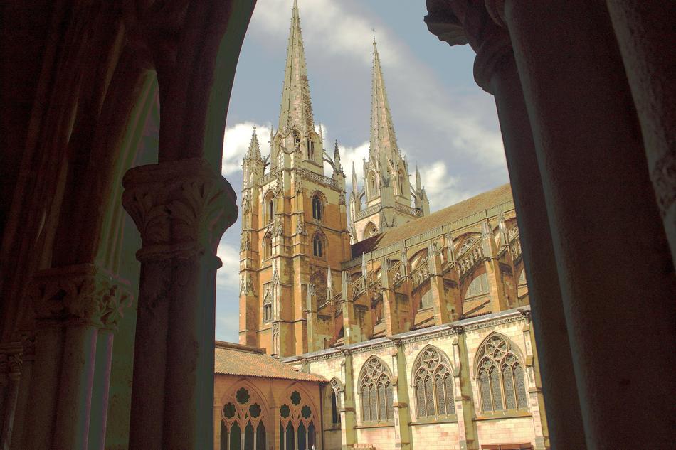 Beautiful church with spires and arches, under the clouds