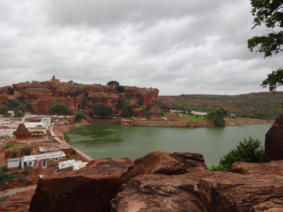 Beautiful and colorful coast of Agasthya Lake in Karnataka, India, with plants, under the clouds
