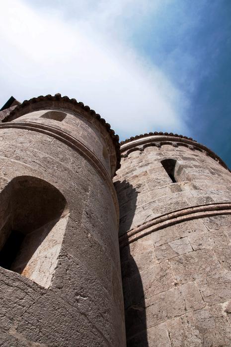 Beautiful towers of the church in sunlight, in Istria, Croatia, under the blue sky with white clouds