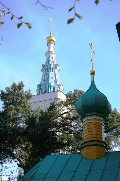 Beautiful and colorful Spasskaya church among the trees in Russia