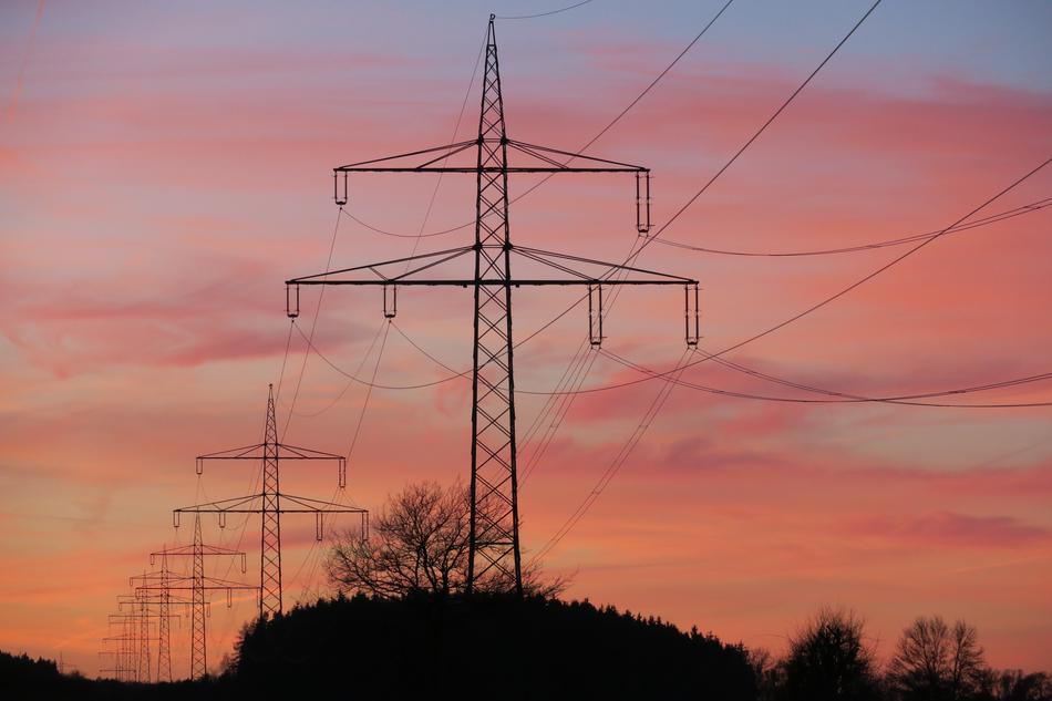 power lines against the background of the evening pink sky