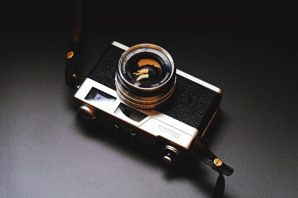 vintage photo camera on gray background