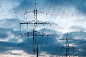 reinforced power lines against a blue sky