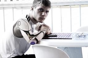 portrait of a young man with a robot arm