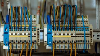 blue and yellow cables with fuses