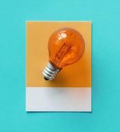 light bulb on orange paper