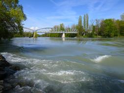 Metal bridge over the flowing water