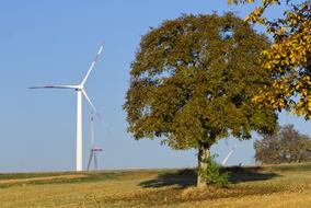 spinning wind turbines on the field