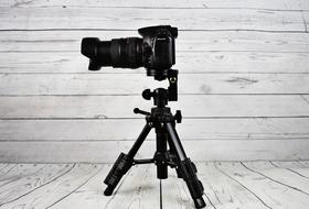 Sony Slt-A58 on a tripod in a wooden room
