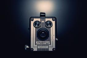 Beautiful, retro "Spartus" camera at background with colorful light