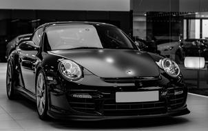 Porsche 911 Gt2Rs in a car dealership in black and white background