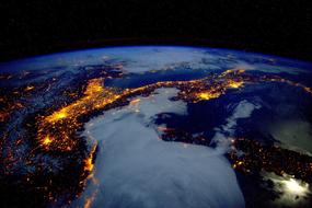 night view from space of alpine mountains in italy