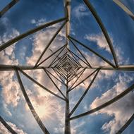 bottom view of a steel structure against the sky