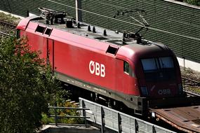 moving red electric locomotive