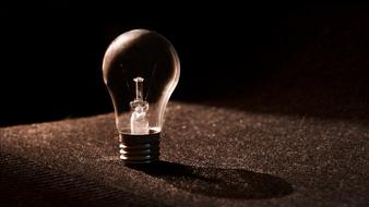 vintage Light bulb stands on Textured surface