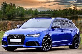 photo of a blue audi on a lake background