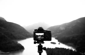 photo shooting over a mountain lake in a blurry background