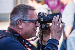 man with Canon camera