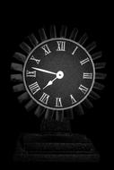black clock in the form of a car turbine