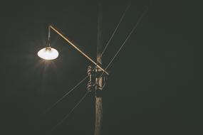 metal street lamp against the night sky
