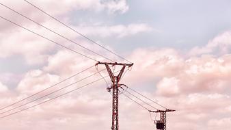 electrical wires on a background of pink clouds