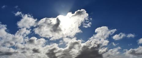 white cumulus clouds on blue sky