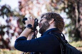 man with digital camera