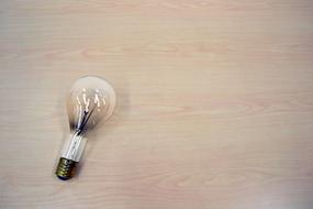 Light Bulb on pink surface, Idea