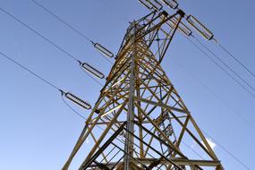 electric pole with wires under the blue sky