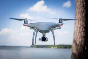 drone with a camera on a background of blue sky