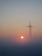 power tower at foggy sunset