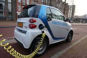 Smartcar charging car in city, netherlands, Amsterdam
