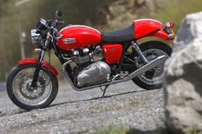 red vintage motorcycle with mono seat