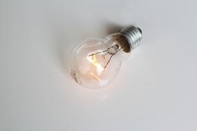 glowing light bulb on white background