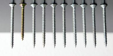 one coated screw among uncoated ones