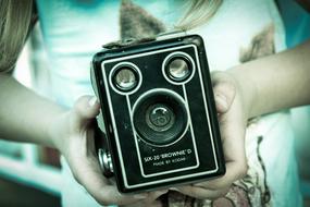 vintage camera in female hands