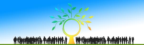 silhouette of a crowd of people and a blossoming tree