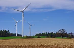 wind turbines on the plowed field