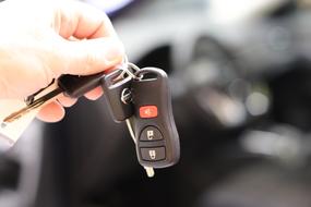 car keys and keychain in hand