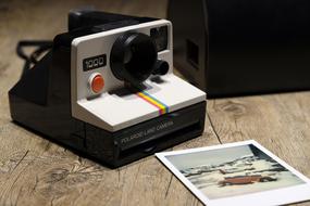 Polaroid Camera and Photo on table