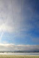 photo of high voltage lines against a blue sky